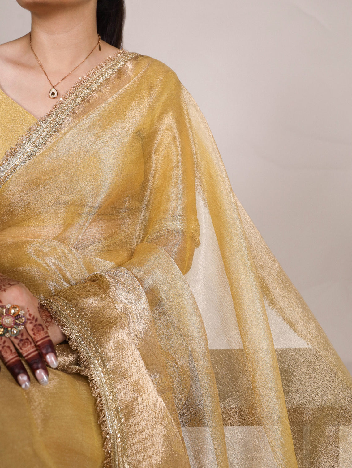 Gold Elegant Tissue Shimmer Saree with Zari Weaving and Sequins Lace Border