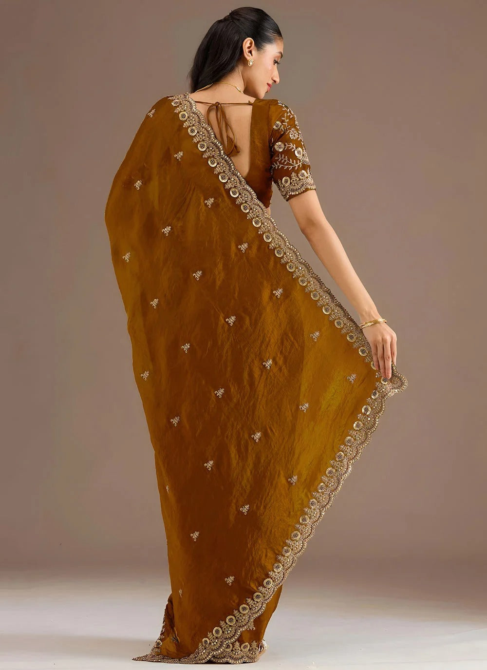 Regal golden tissue silk saree with zari dori sequins embroidery