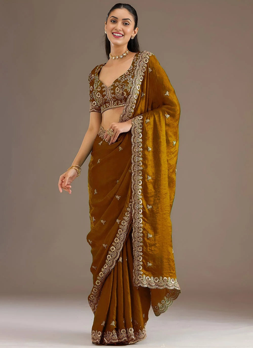 Regal golden tissue silk saree with zari dori sequins embroidery