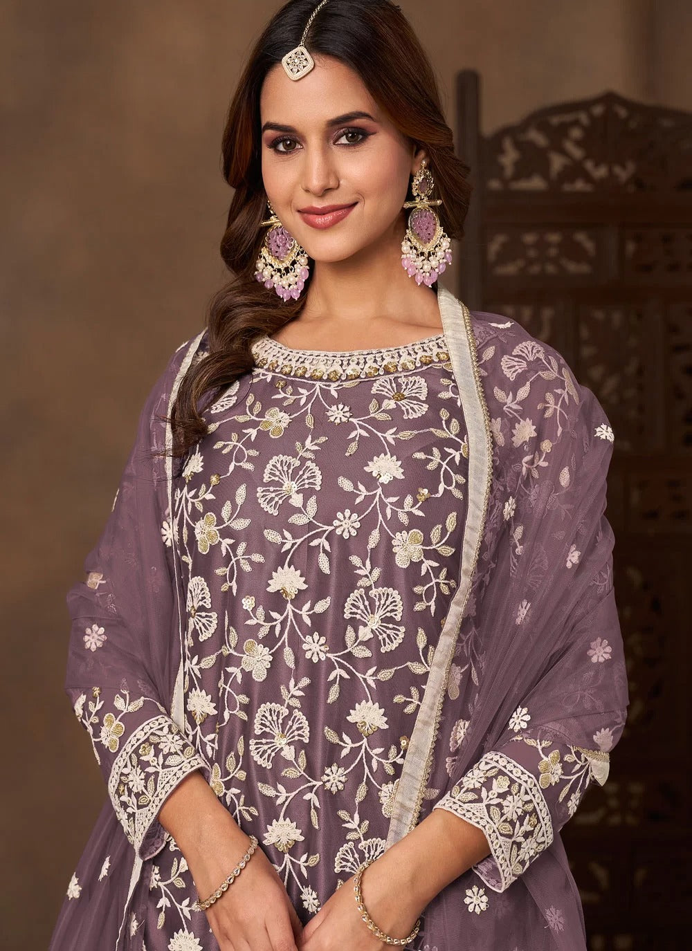 Graceful lavender net embroidered palazzo salwar suit with satin inner