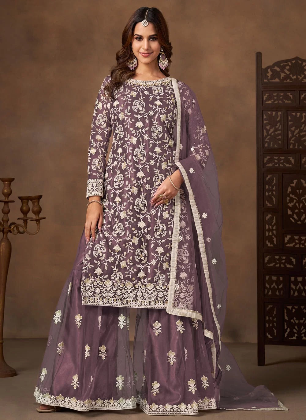 Graceful lavender net embroidered palazzo salwar suit with satin inner