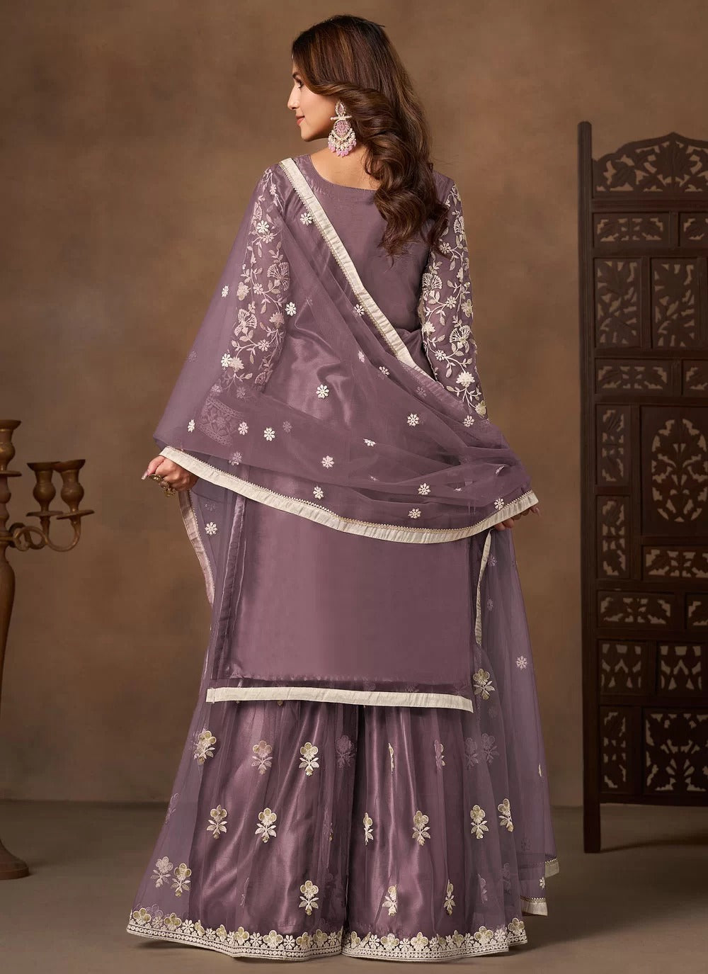 Graceful lavender net embroidered palazzo salwar suit with satin inner