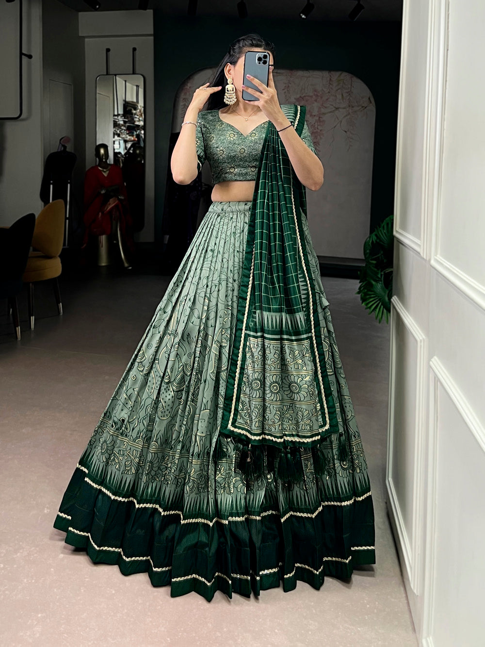 Green tasar silk kalamkari print lehenga choli with lace border tassel dupatta