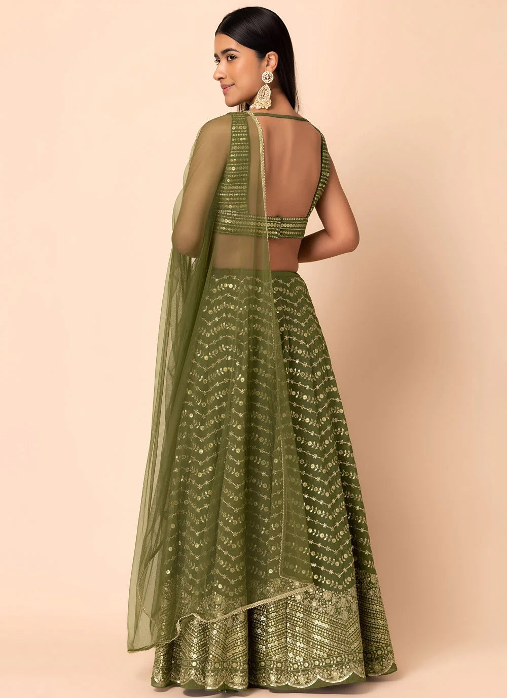 Emerald green engagement lehenga in georgette with sequins embroidery
