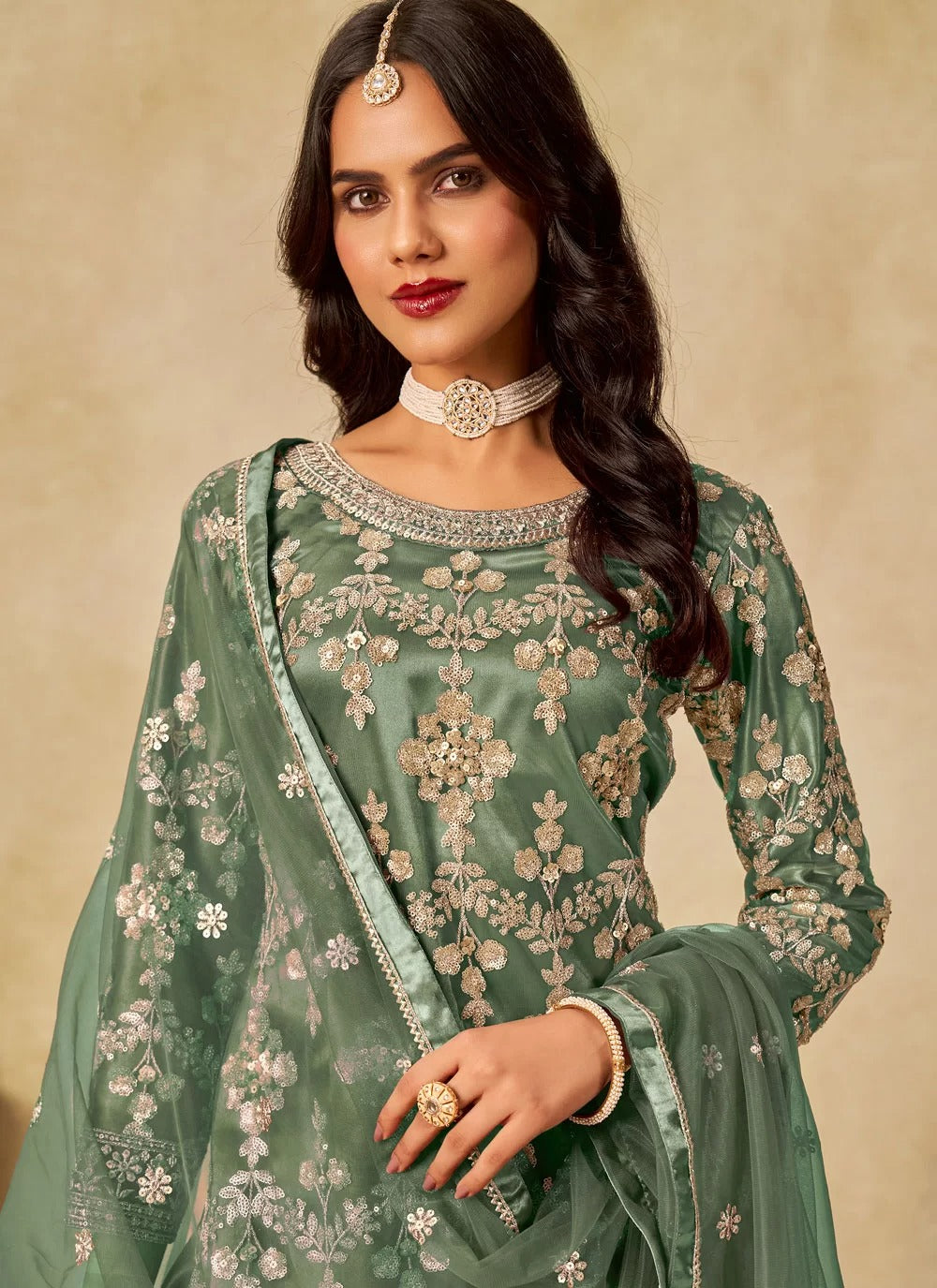 Gorgeous green sequins embroidered net sharara suit with satin inner