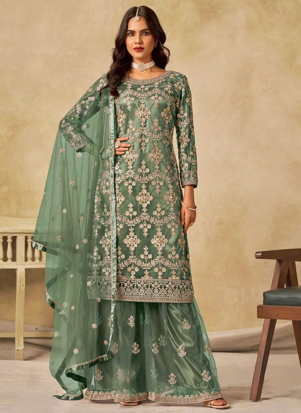 Gorgeous green sequins embroidered net sharara suit with satin inner