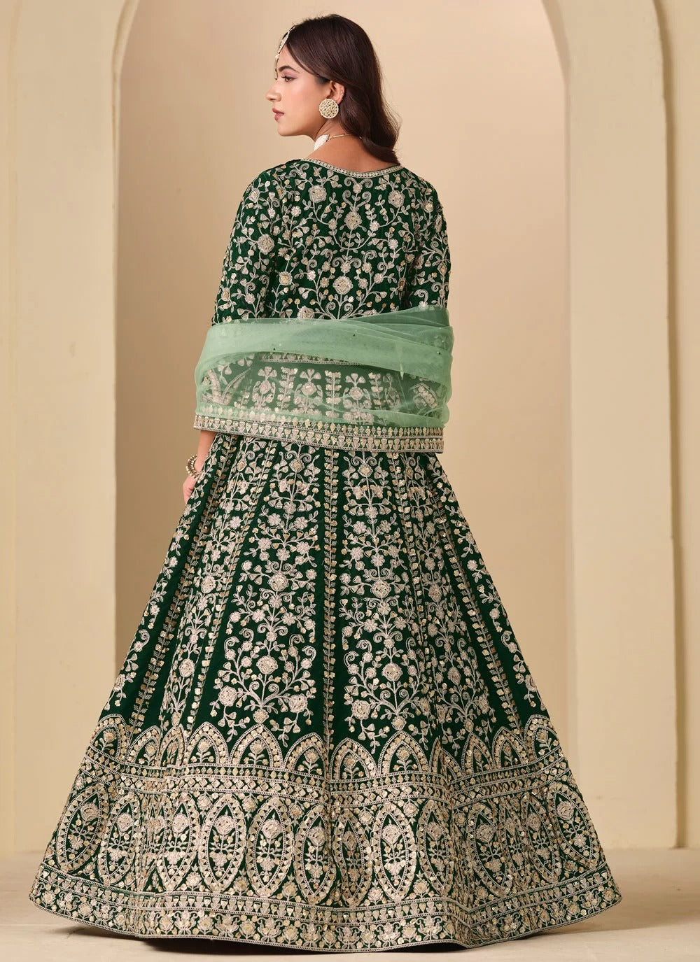 Embroidered green velvet abaya style anarkali suit with net dupatta