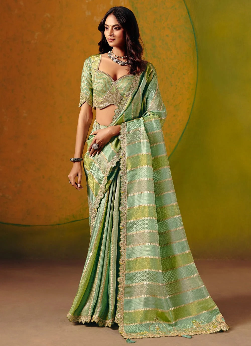 Green wedding guest saree in jacquard silk with readymade embroidered blouse