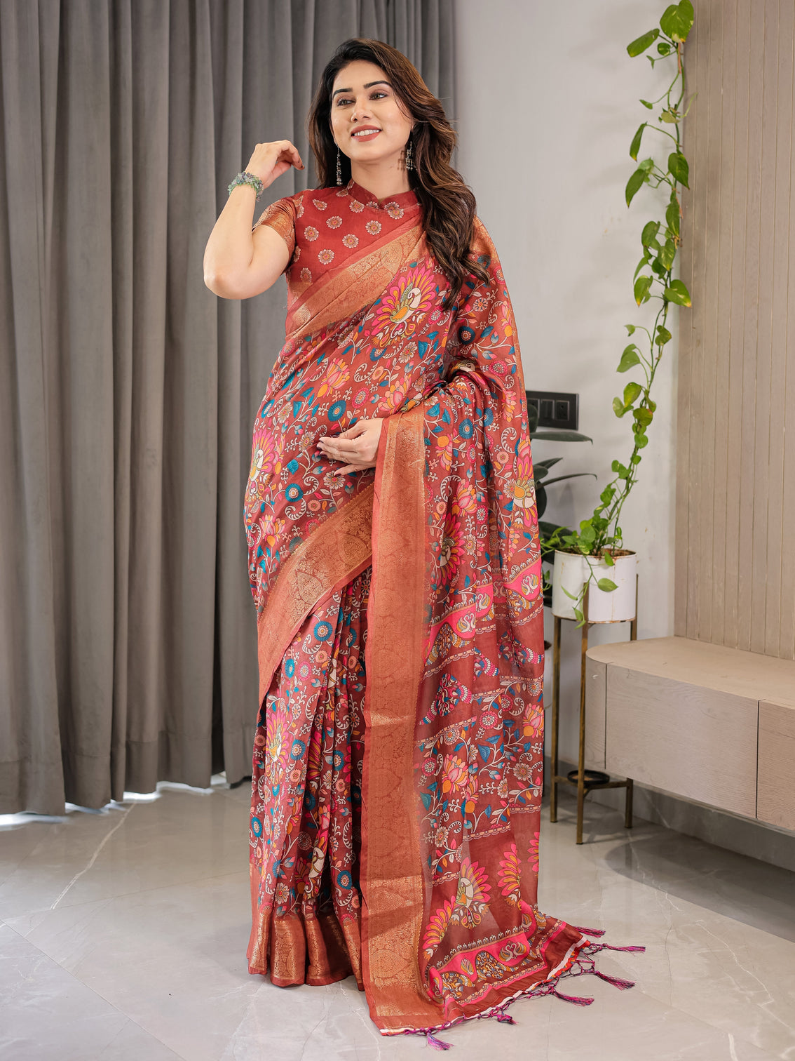 Graceful rust orange floral cotton linen saree with zari border tassels