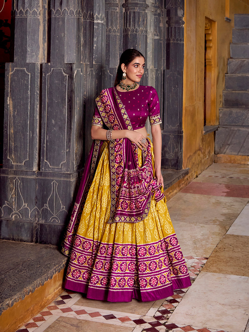 Mustard tasar silk ikat patola print lehenga choli set with wine embroidered blouse dupatta