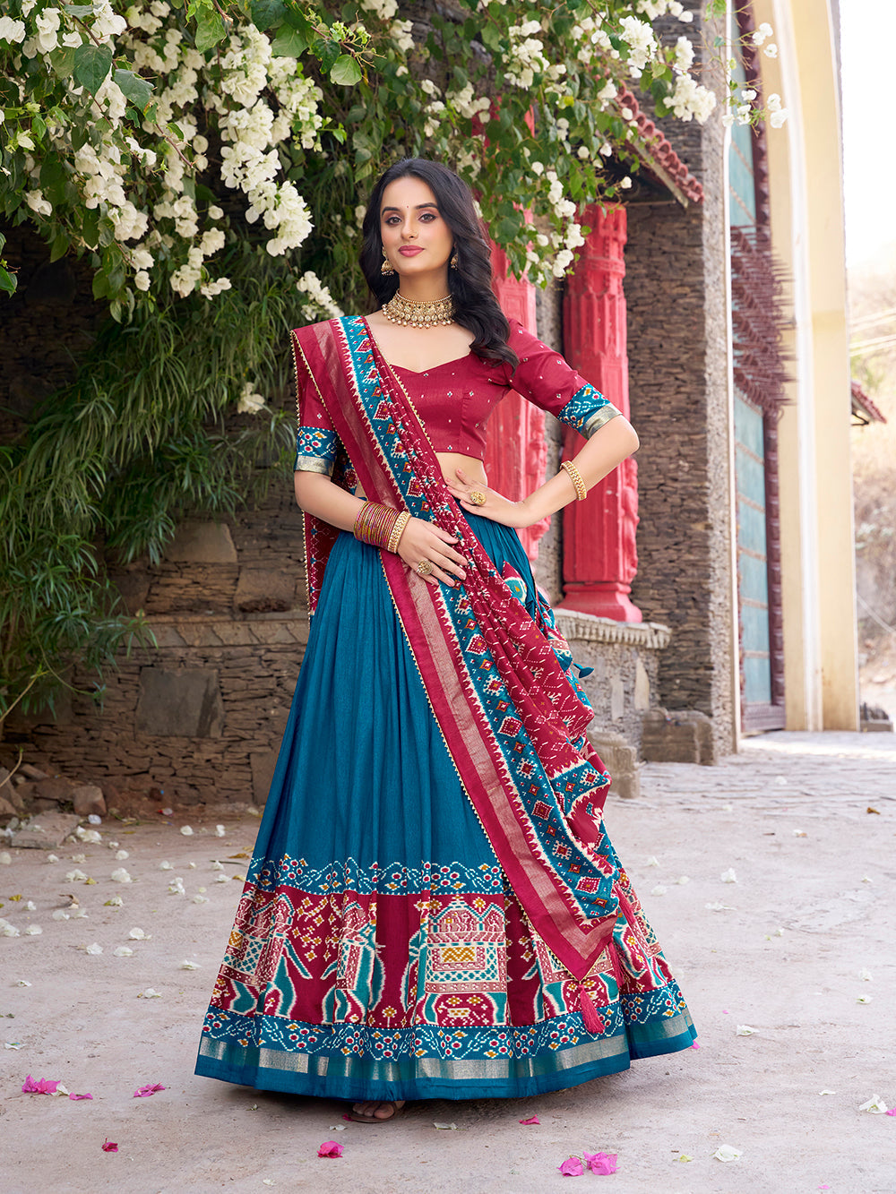 Teal tasar silk lehenga choli with patola print foil work matching dupatta