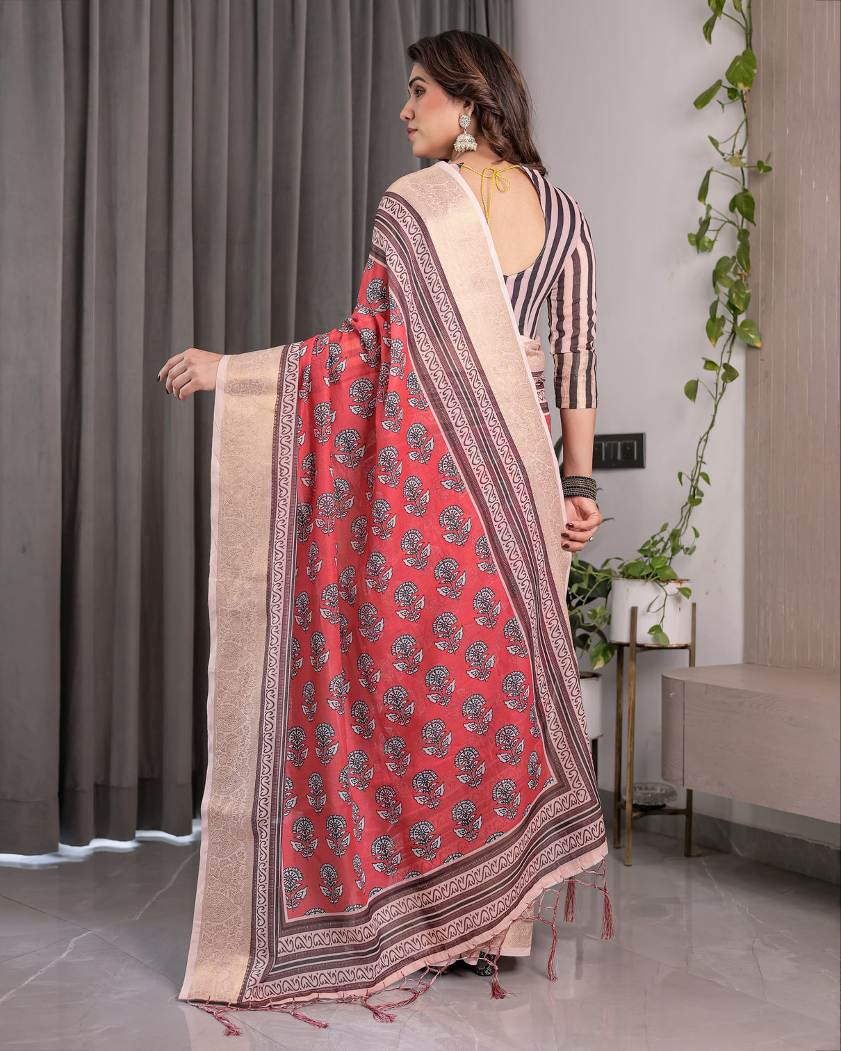 Rust red handloom cotton linen saree with black floral buti print zari border