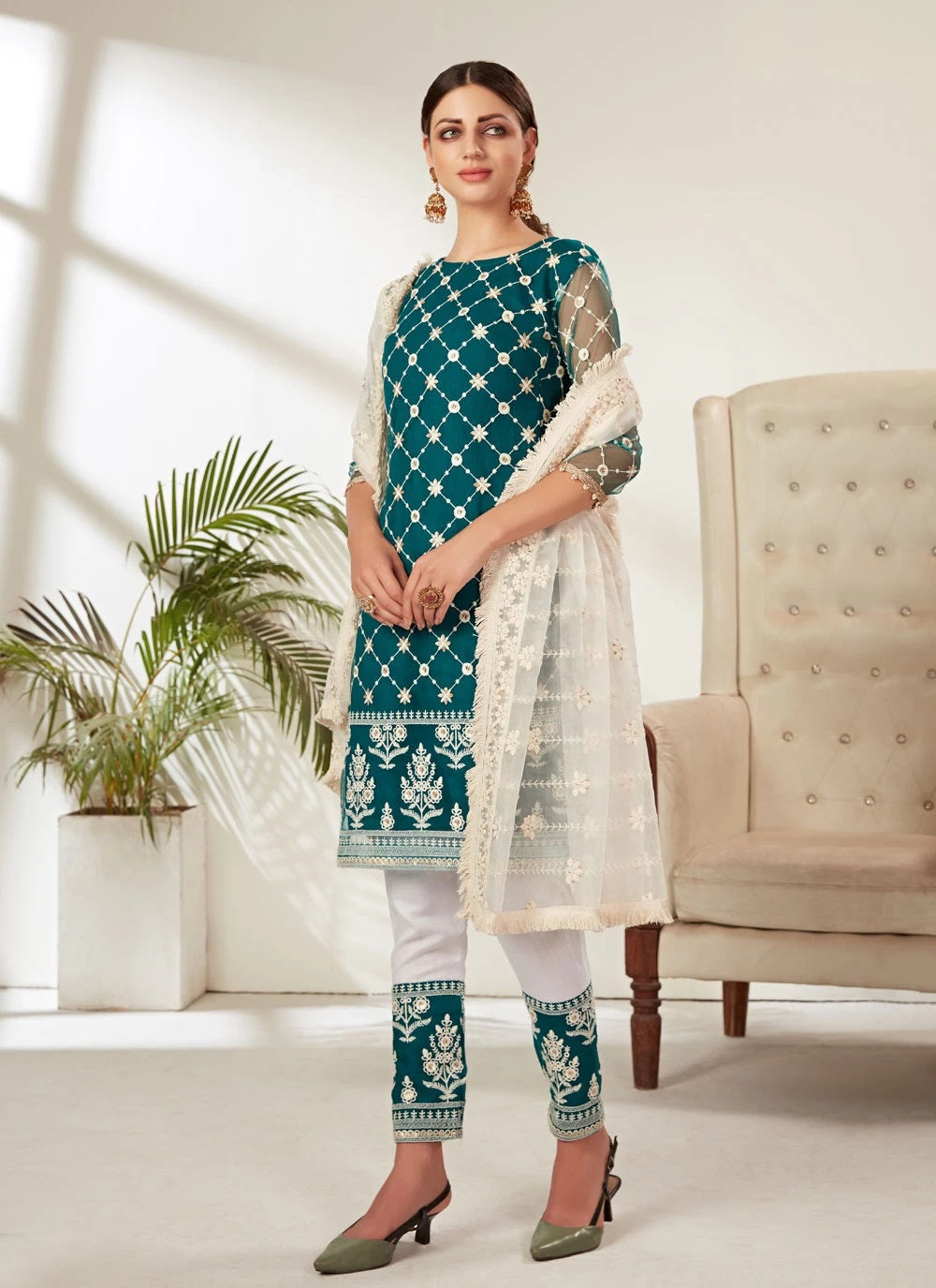 Heavy butterfly net pakistani embroidered suit in rama