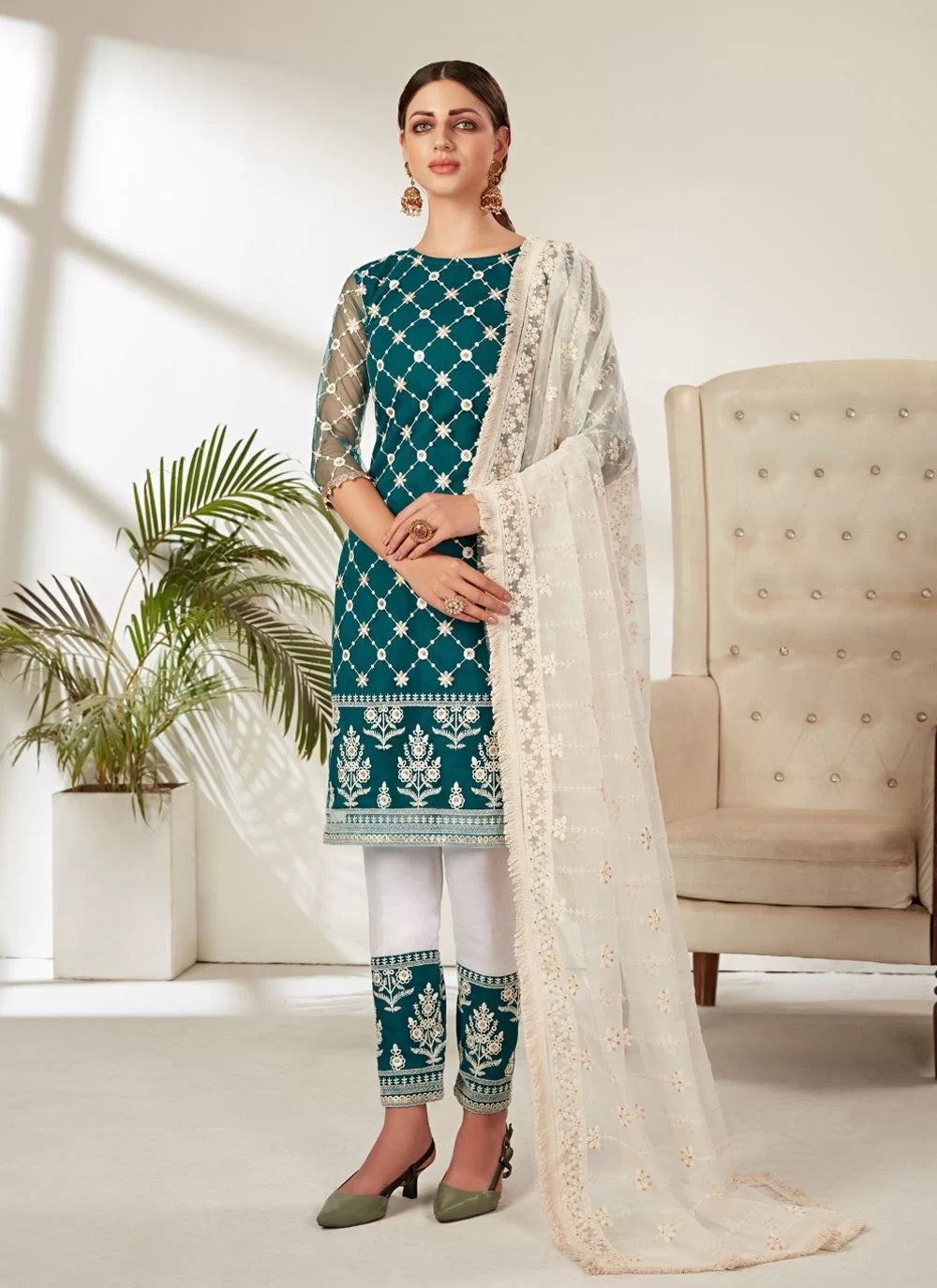Heavy butterfly net pakistani embroidered suit in rama