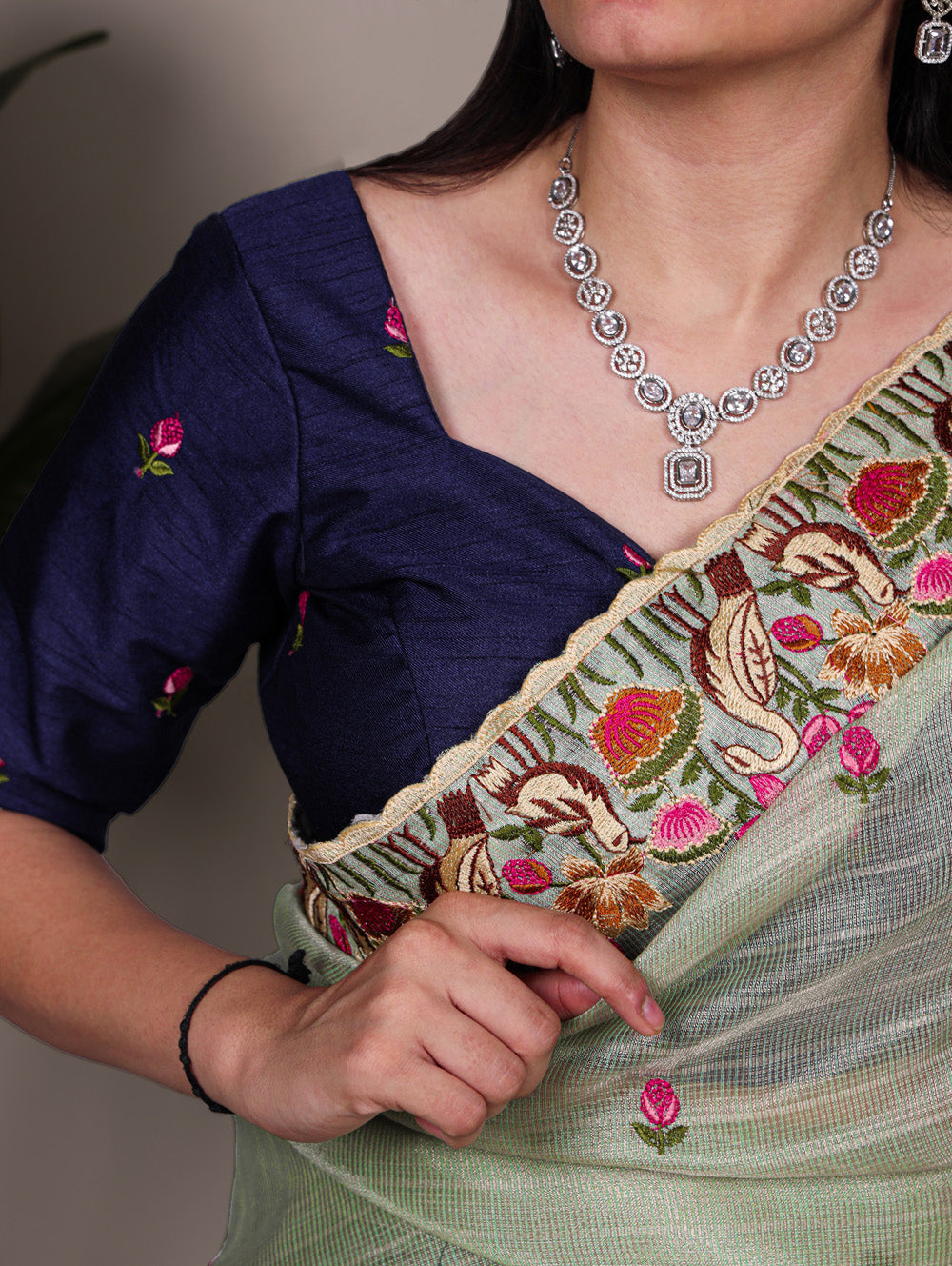 Sea green zari kota tissue saree with floral thread embroidery and banglory blouse fabric