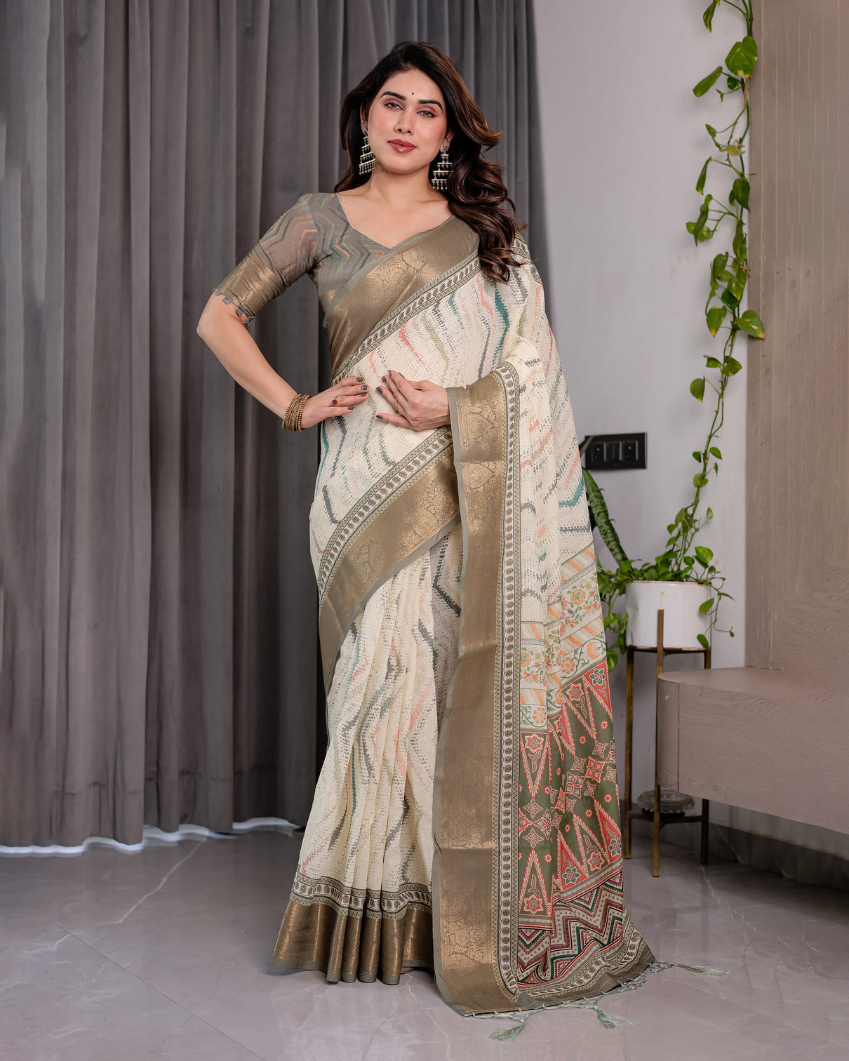 Elegant cream gold woven ikat silk saree with designer border with tassles