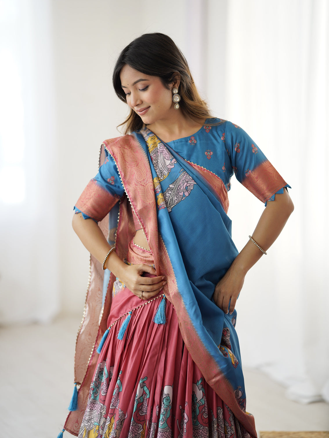 Elegant kalamkari lehenga in blue and terracotta pink with flared skirt and dupatta