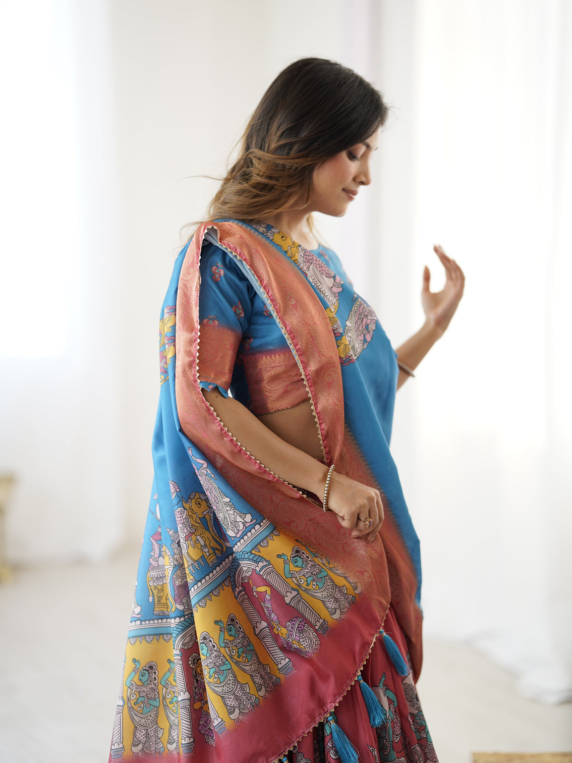 Elegant kalamkari lehenga in blue and terracotta pink with flared skirt and dupatta
