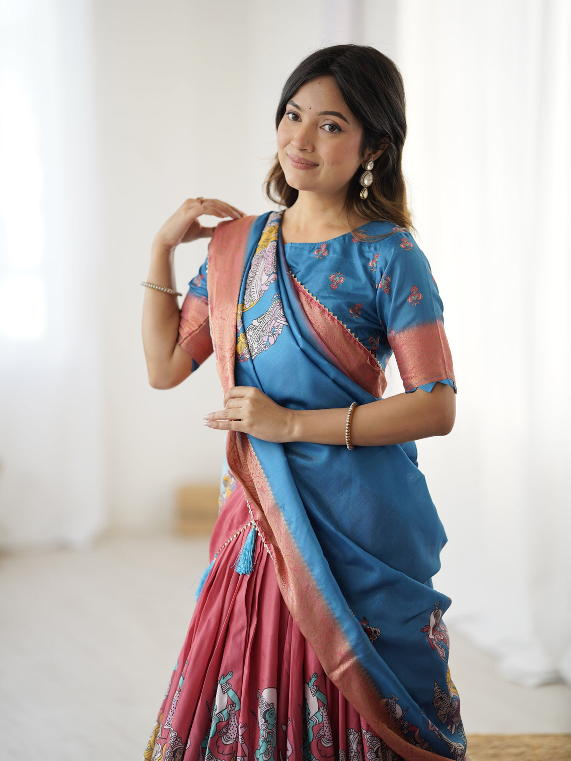 Elegant kalamkari lehenga in blue and terracotta pink with flared skirt and dupatta