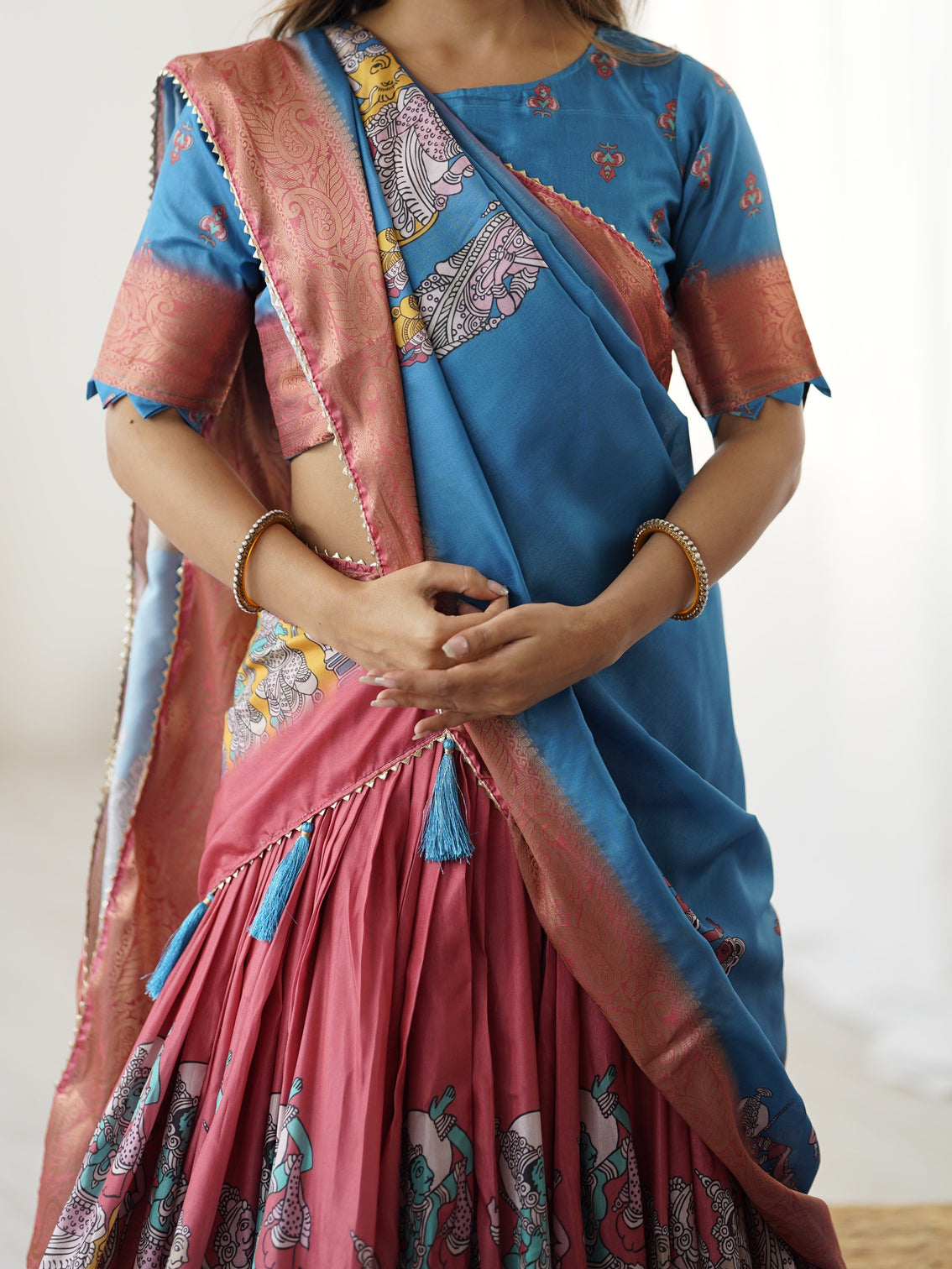 Elegant kalamkari lehenga in blue and terracotta pink with flared skirt and dupatta