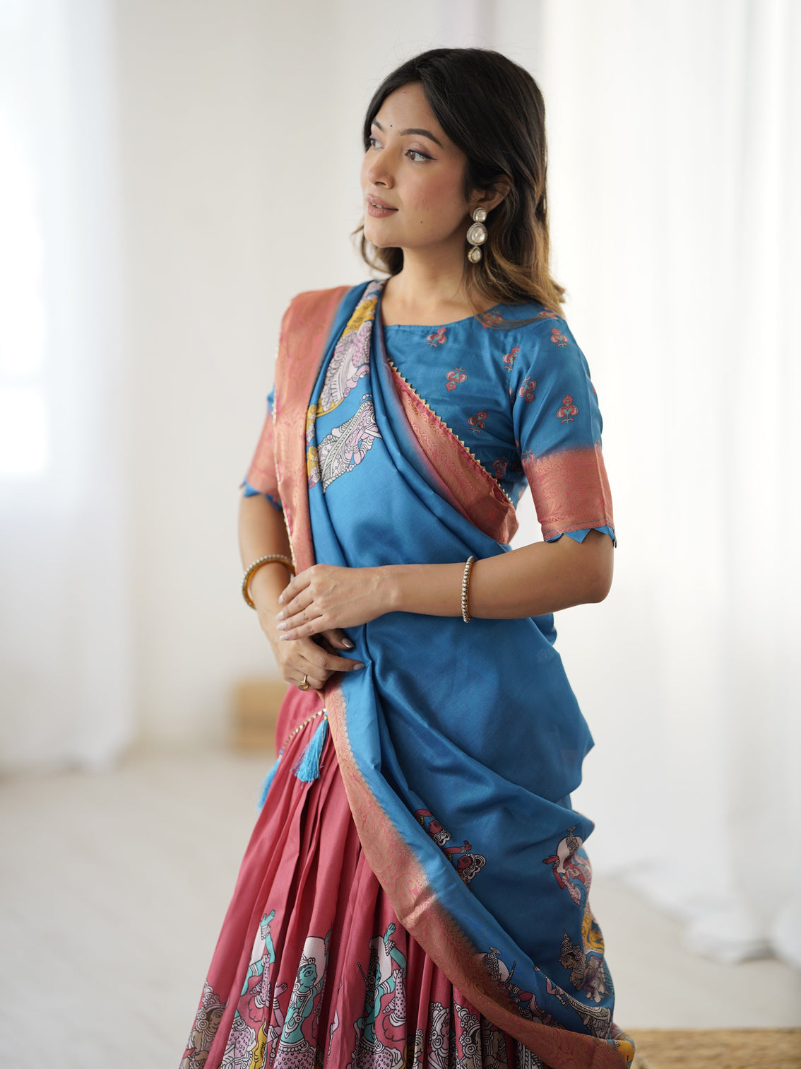 Elegant kalamkari lehenga in blue and terracotta pink with flared skirt and dupatta