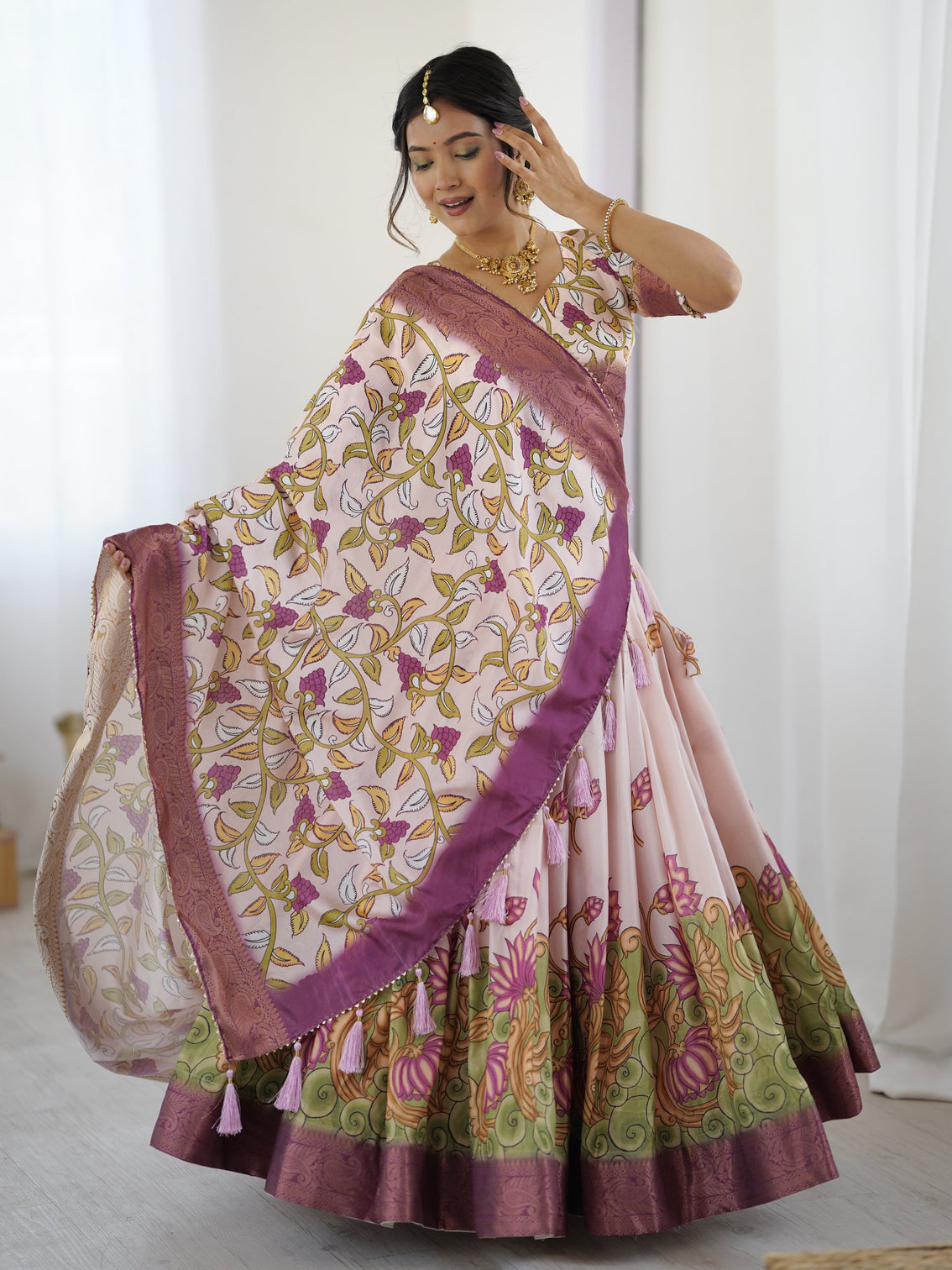 Pastel pink kalamkari silk lehenga with tassel dupatta zari border festive wedding wear
