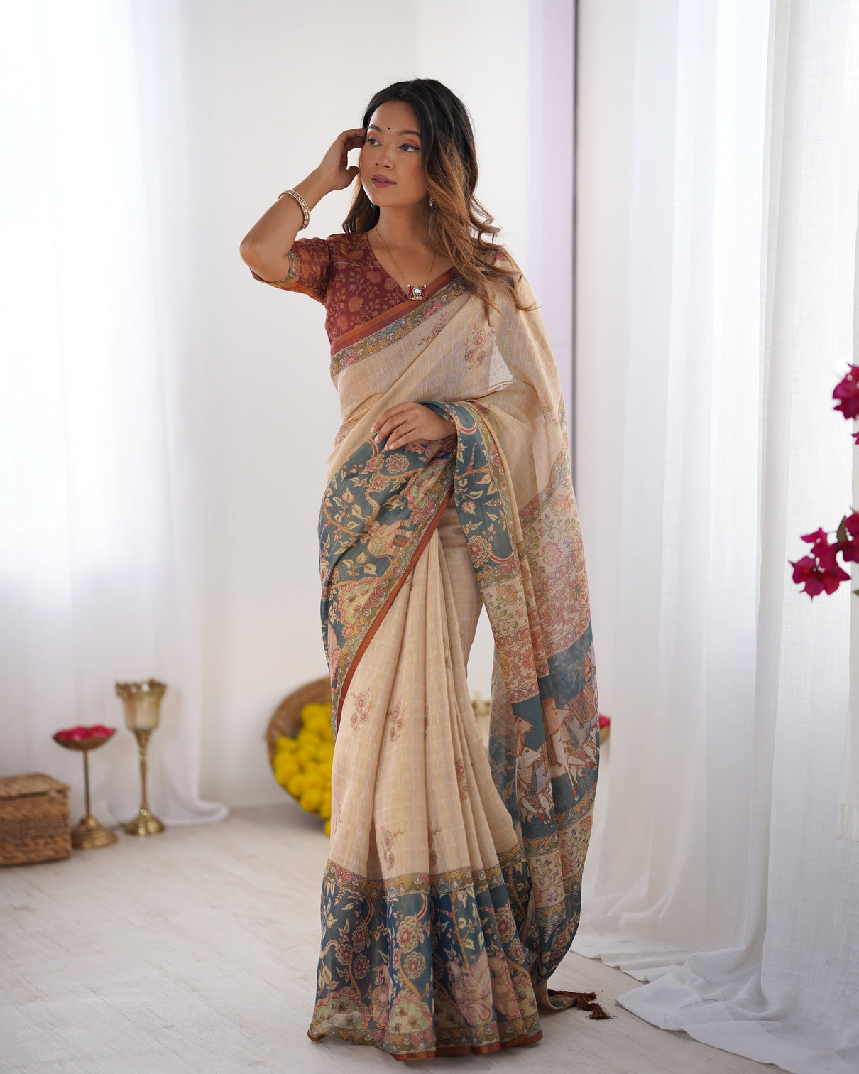 Beige handloom cotton saree with maroon blouse and multicolor royal procession pallu