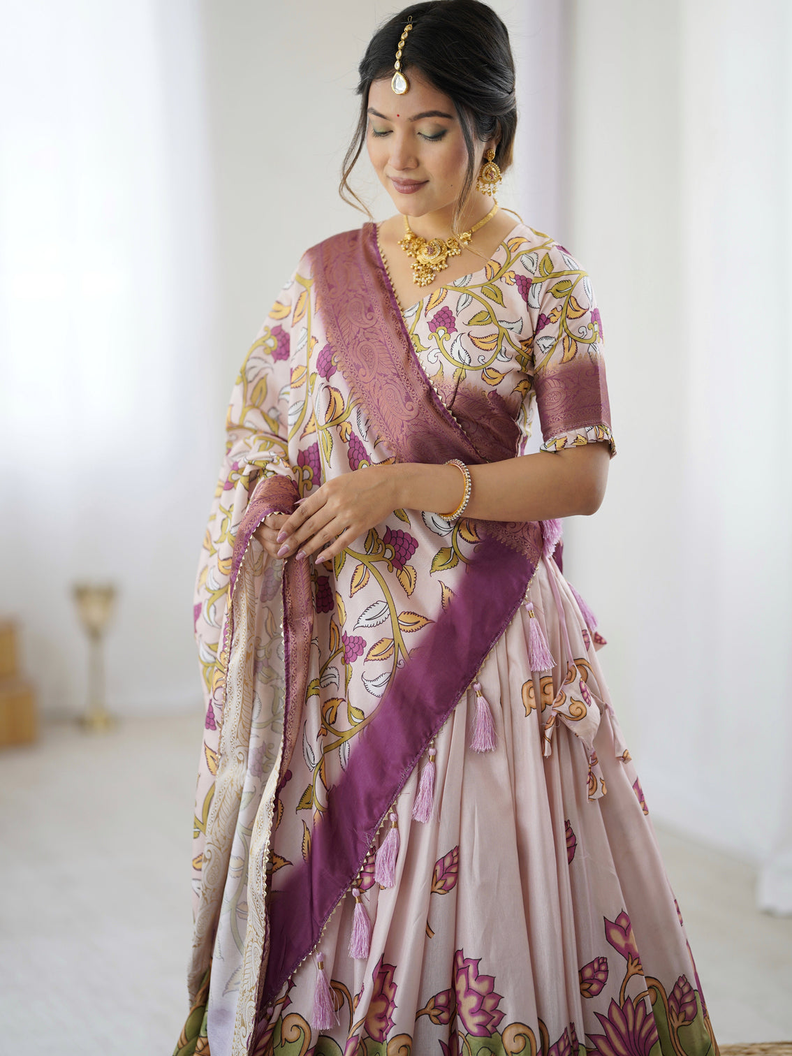 Pastel pink kalamkari silk lehenga with tassel dupatta zari border festive wedding wear
