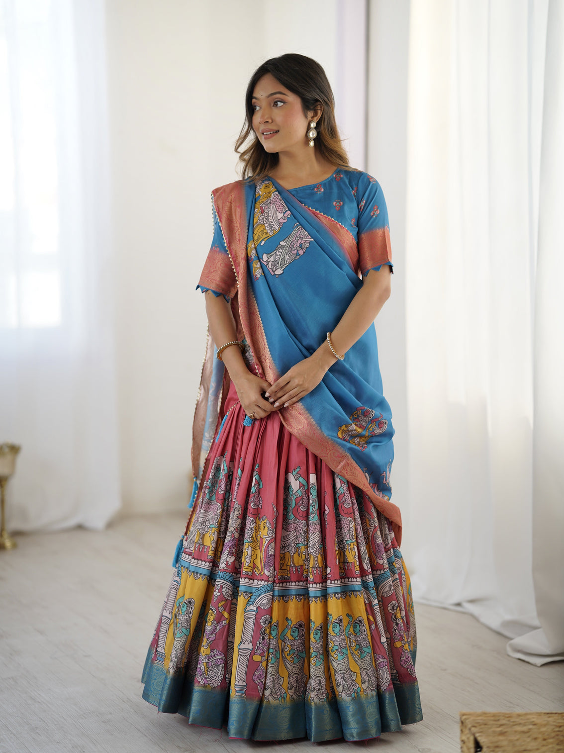 Elegant kalamkari lehenga in blue and terracotta pink with flared skirt and dupatta