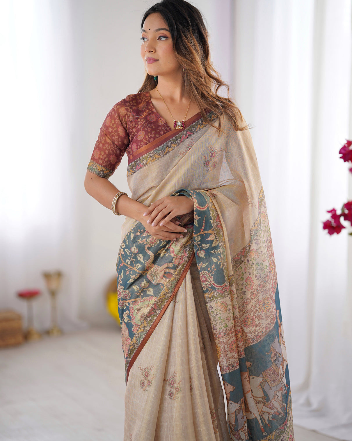 Beige handloom cotton saree with maroon blouse and multicolor royal procession pallu