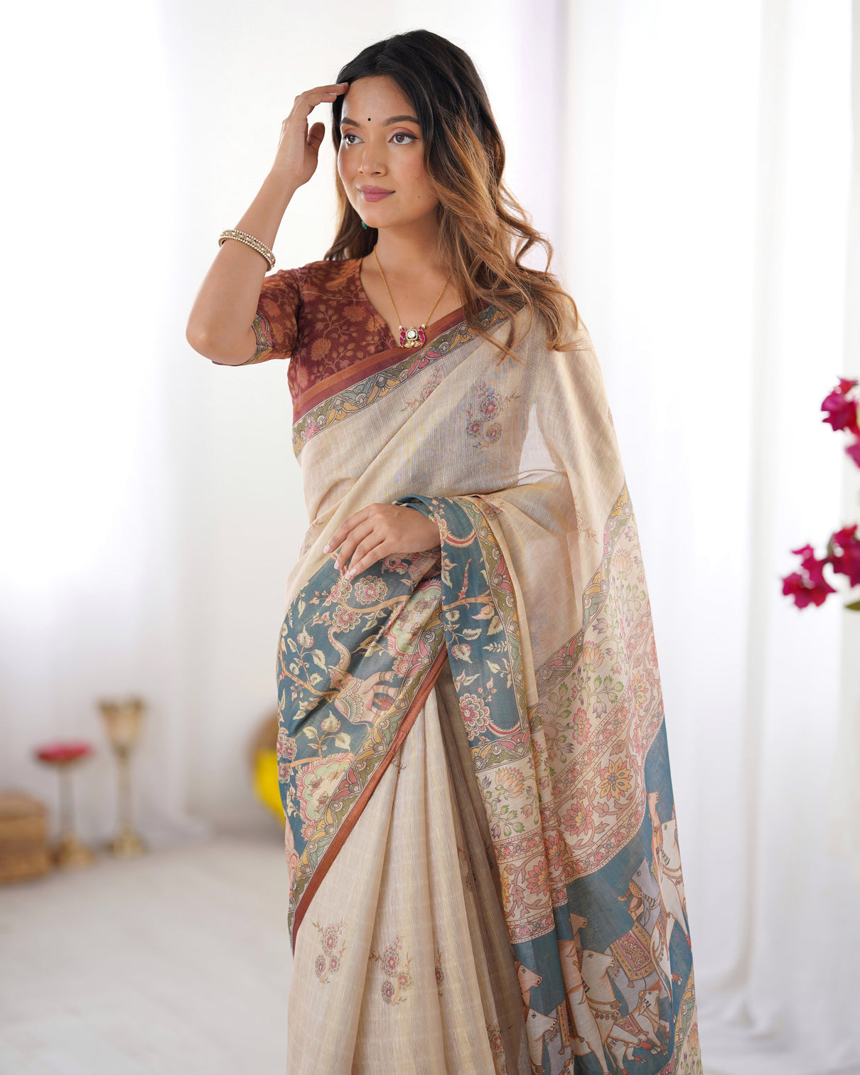 Beige handloom cotton saree with maroon blouse and multicolor royal procession pallu