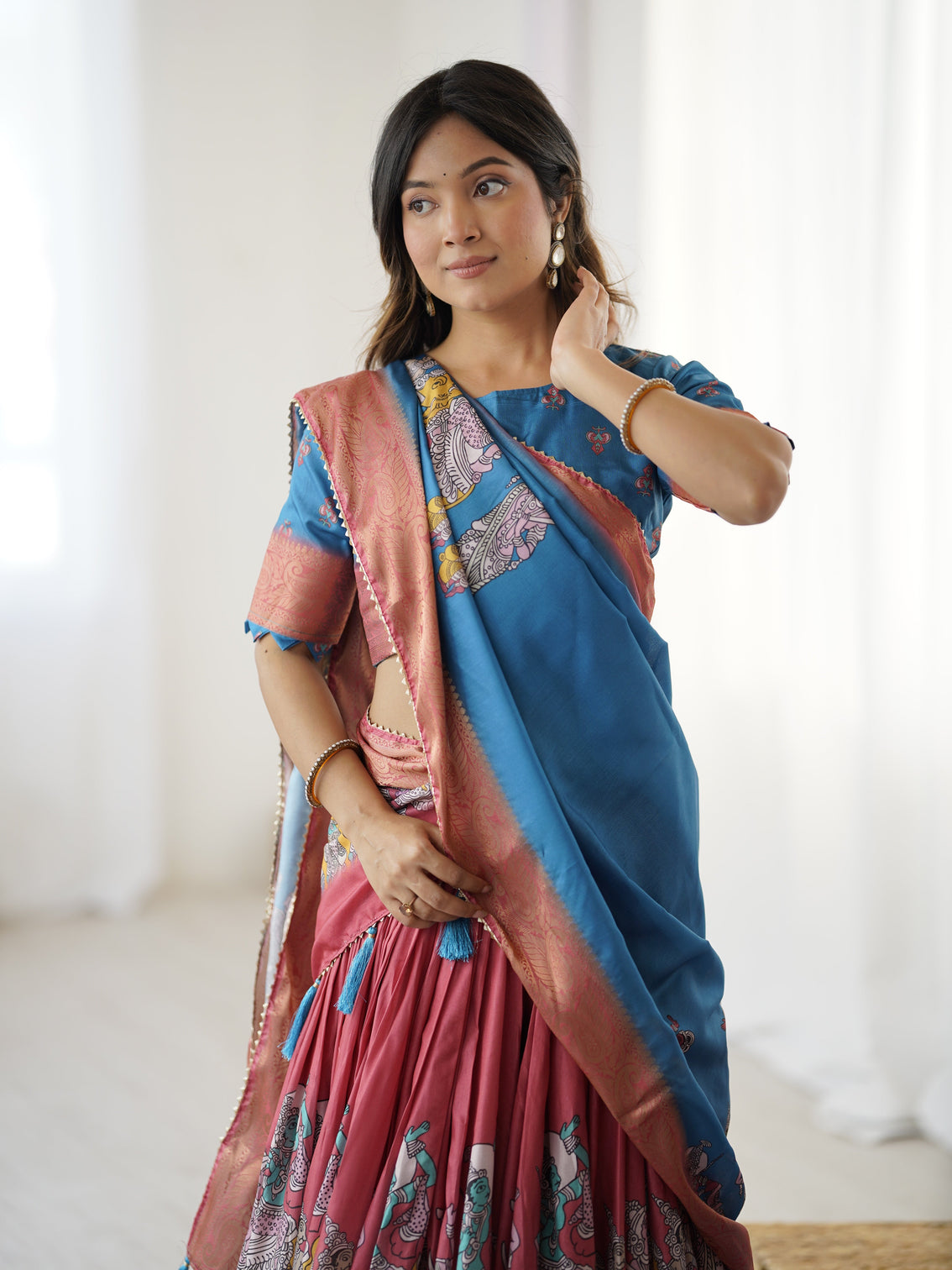 Elegant kalamkari lehenga in blue and terracotta pink with flared skirt and dupatta