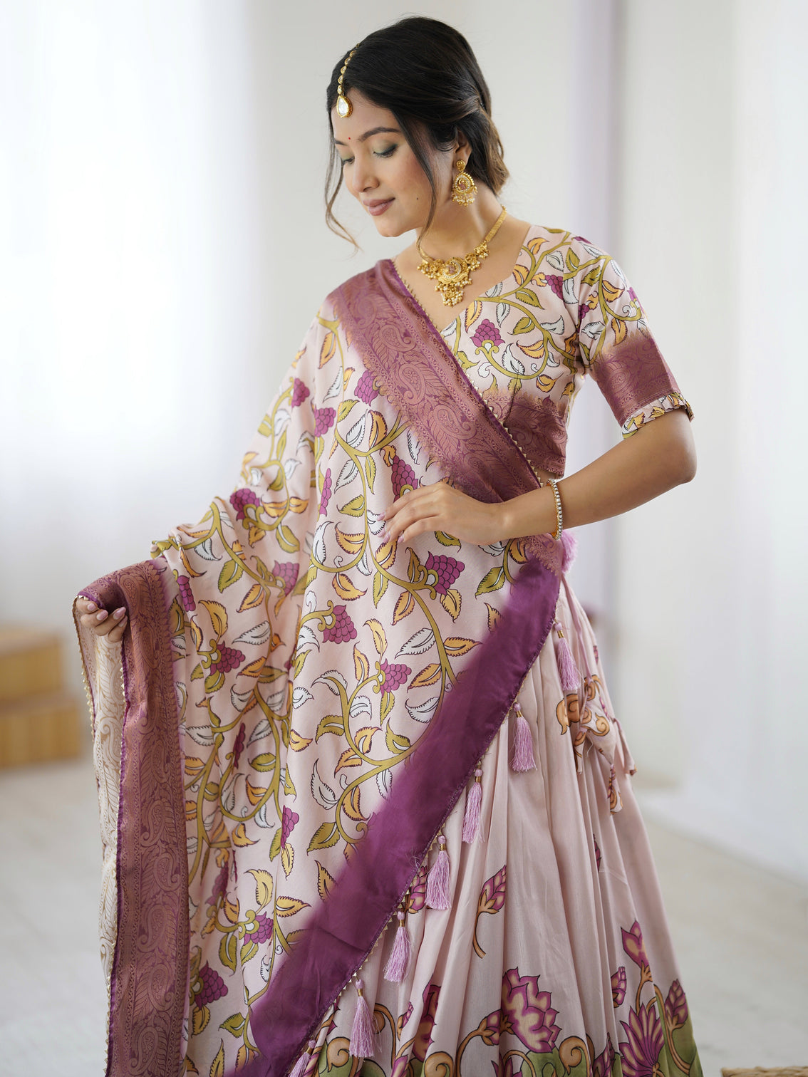 Pastel pink kalamkari silk lehenga with tassel dupatta zari border festive wedding wear