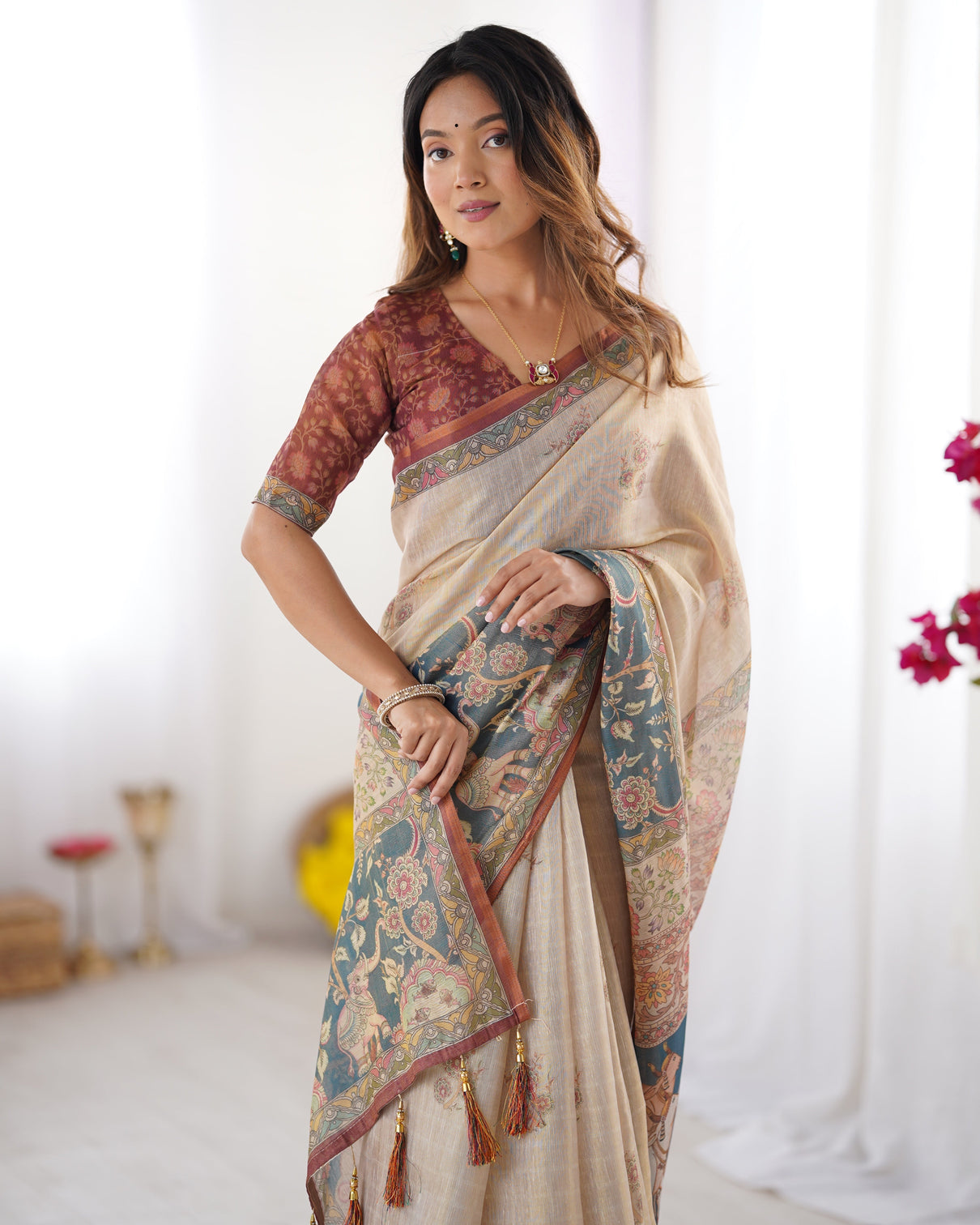 Beige handloom cotton saree with maroon blouse and multicolor royal procession pallu