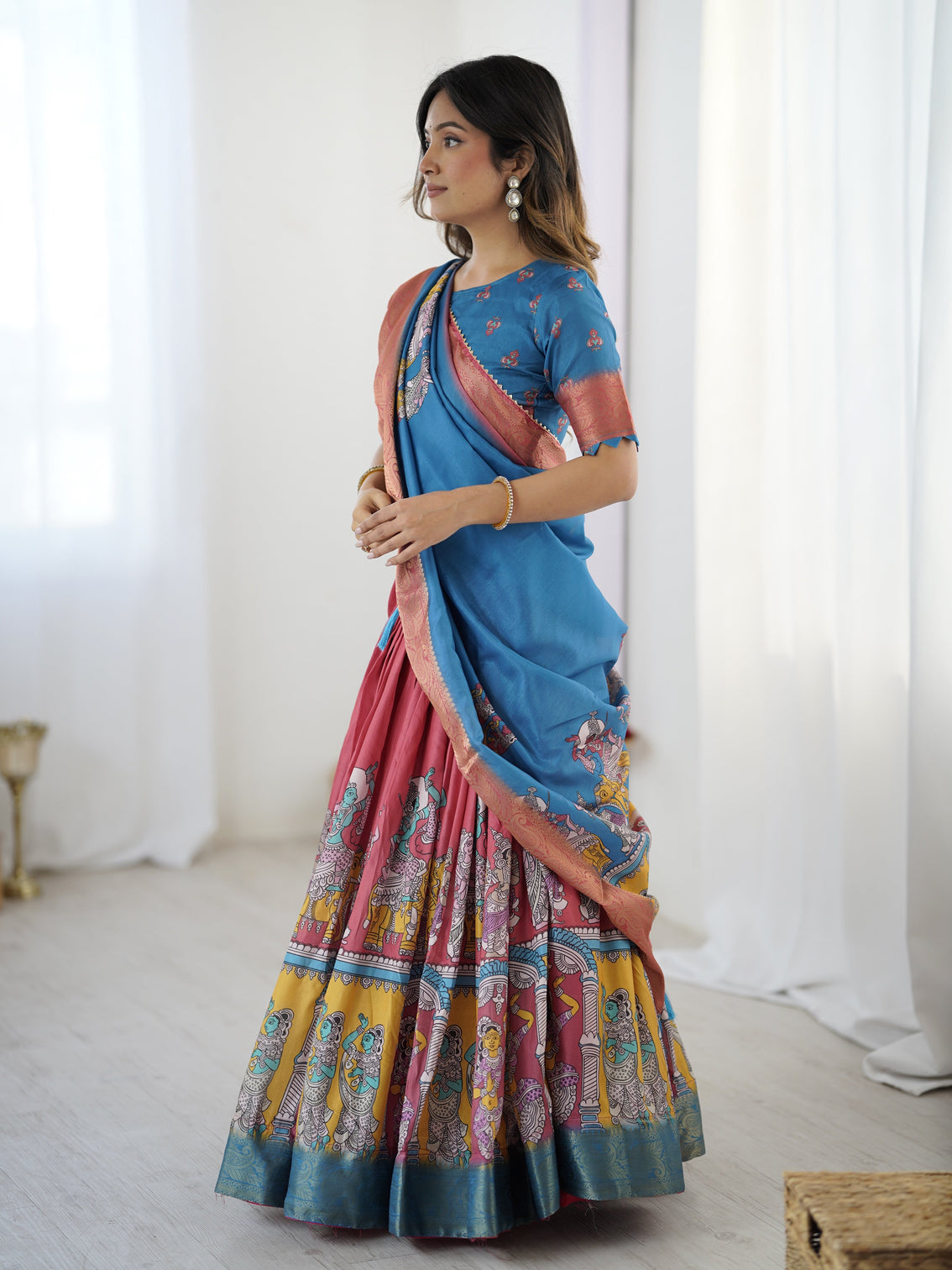 Elegant kalamkari lehenga in blue and terracotta pink with flared skirt and dupatta