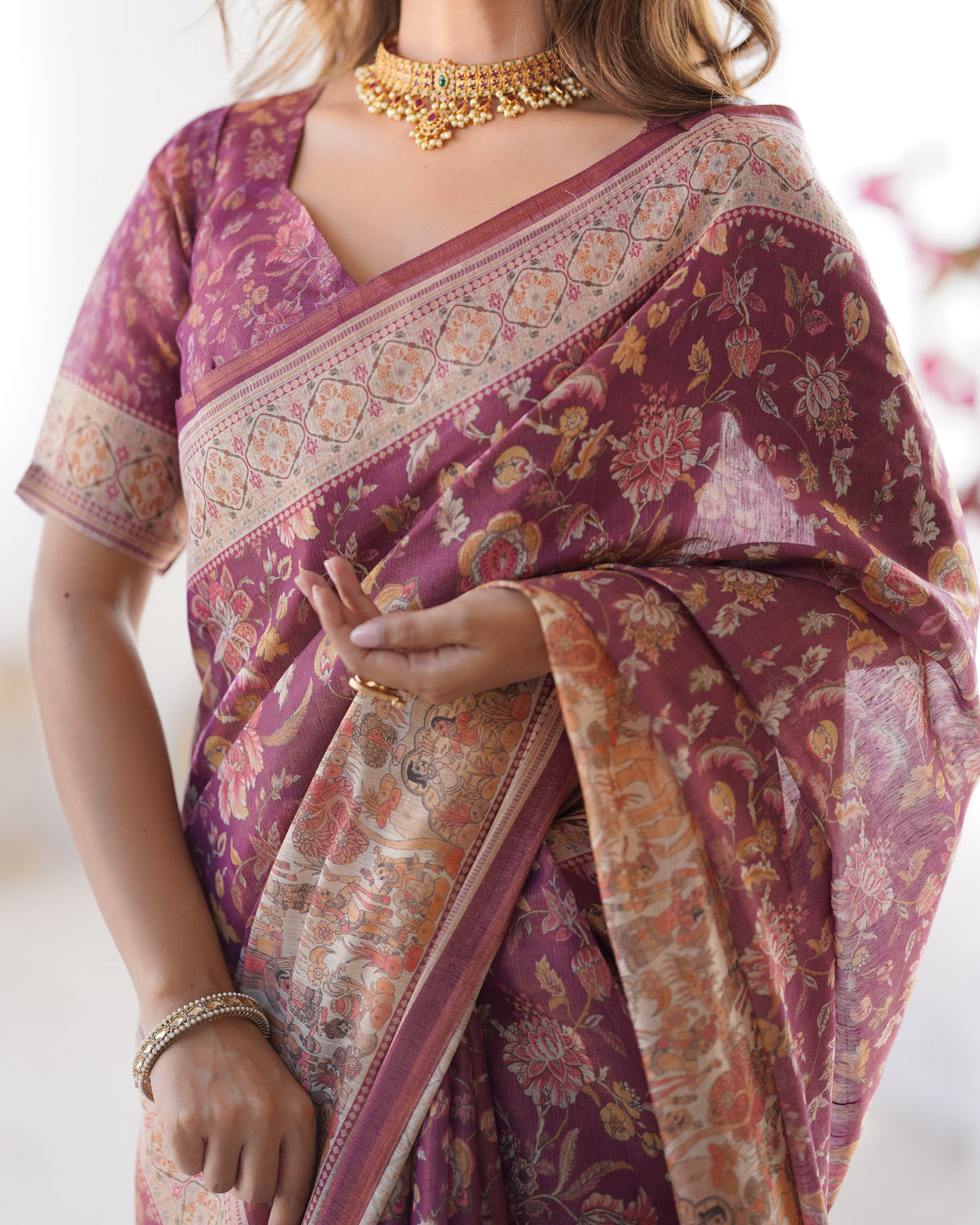 Plum handloom cotton saree with floral print mythical border tassels