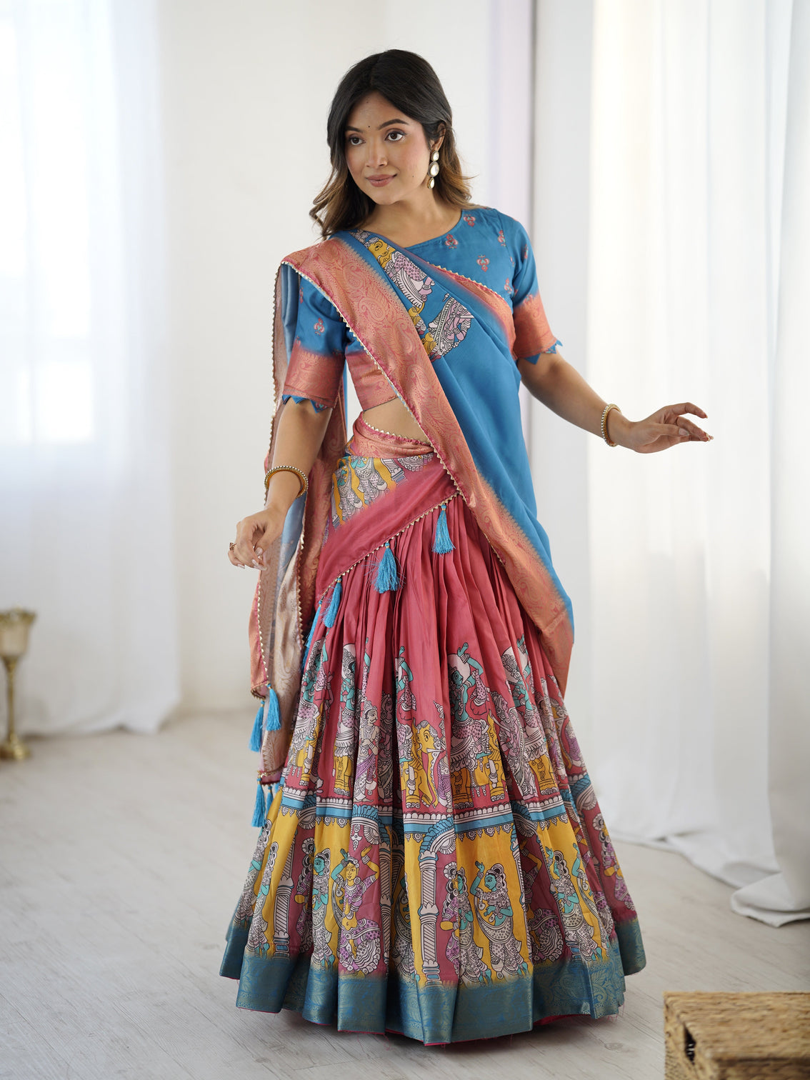 Elegant kalamkari lehenga in blue and terracotta pink with flared skirt and dupatta