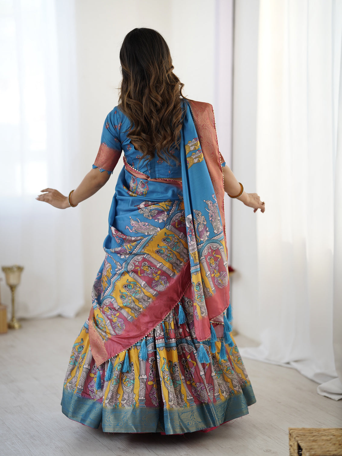 Elegant kalamkari lehenga in blue and terracotta pink with flared skirt and dupatta