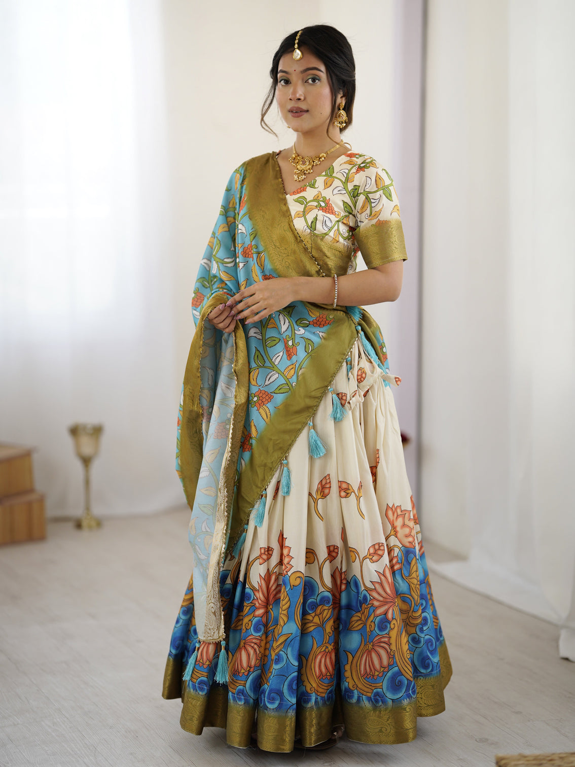 Off white blue kalamkari silk lehenga with olive zari border tassel dupatta festive wedding wear