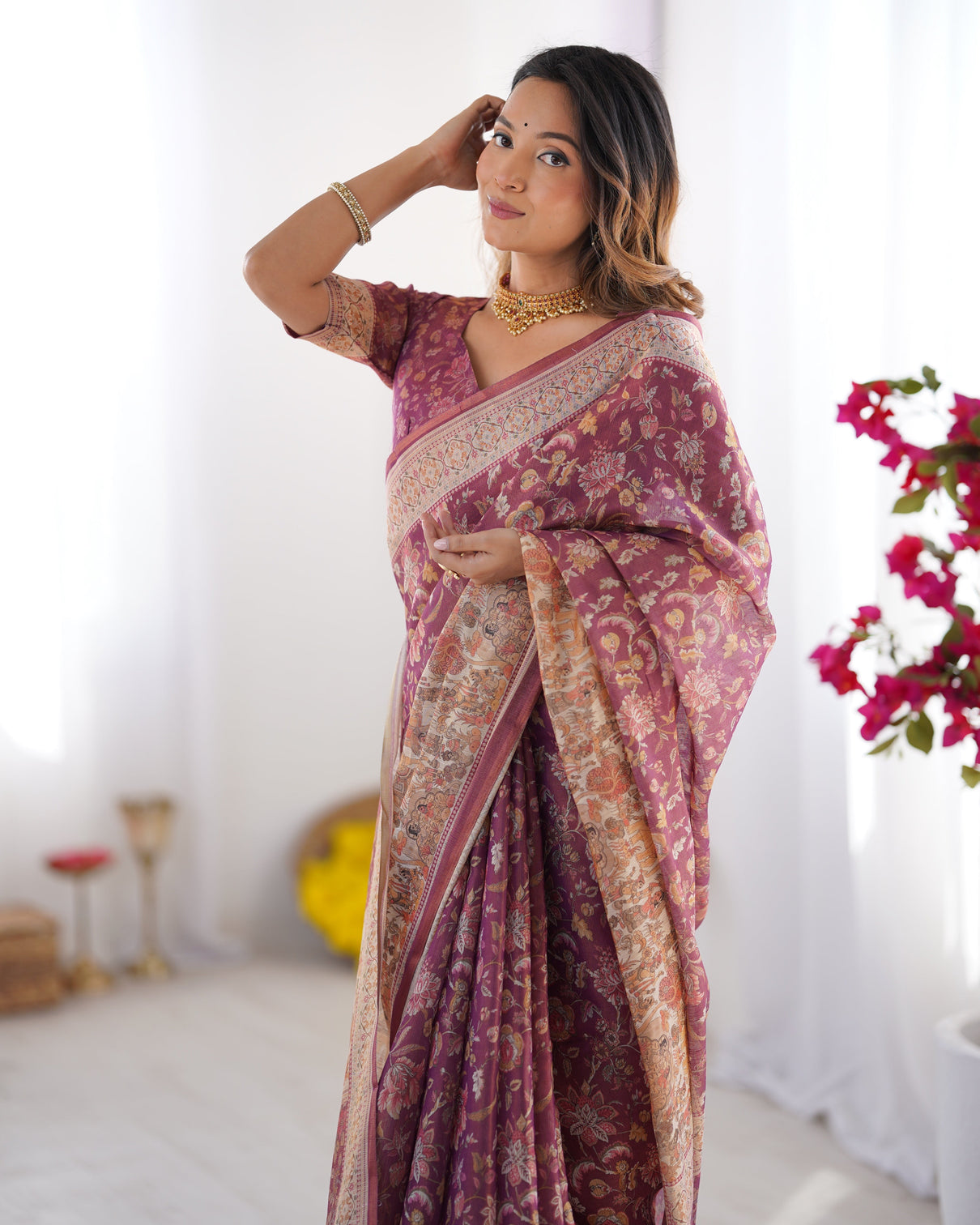 Plum handloom cotton saree with floral print mythical border tassels