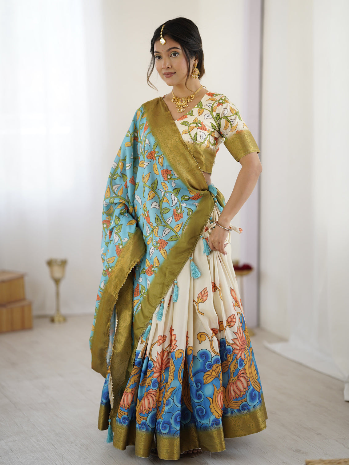 Off white blue kalamkari silk lehenga with olive zari border tassel dupatta festive wedding wear