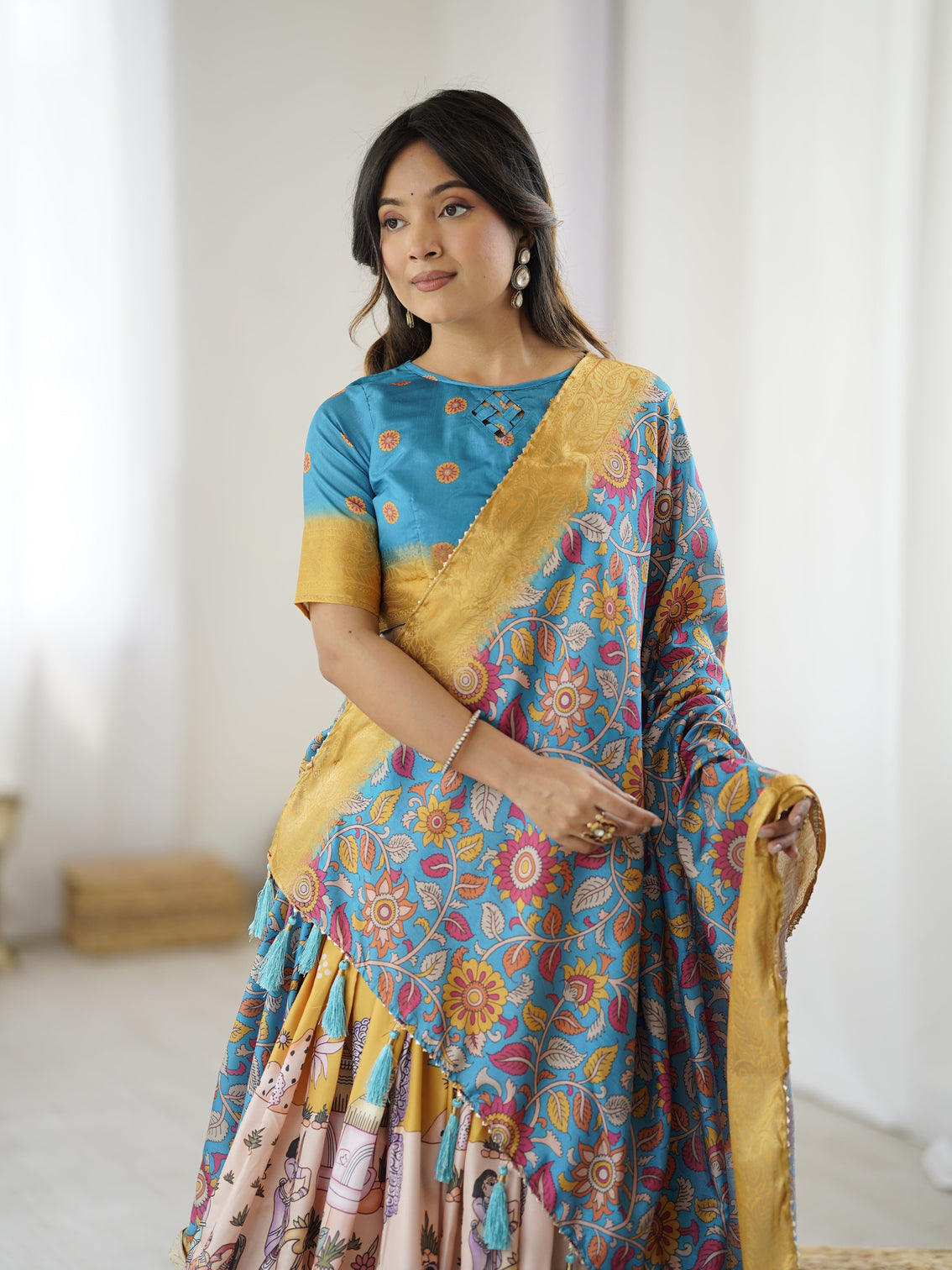 Elegant kalamkari lehenga in blue and peach with floral dupatta and flared skirt