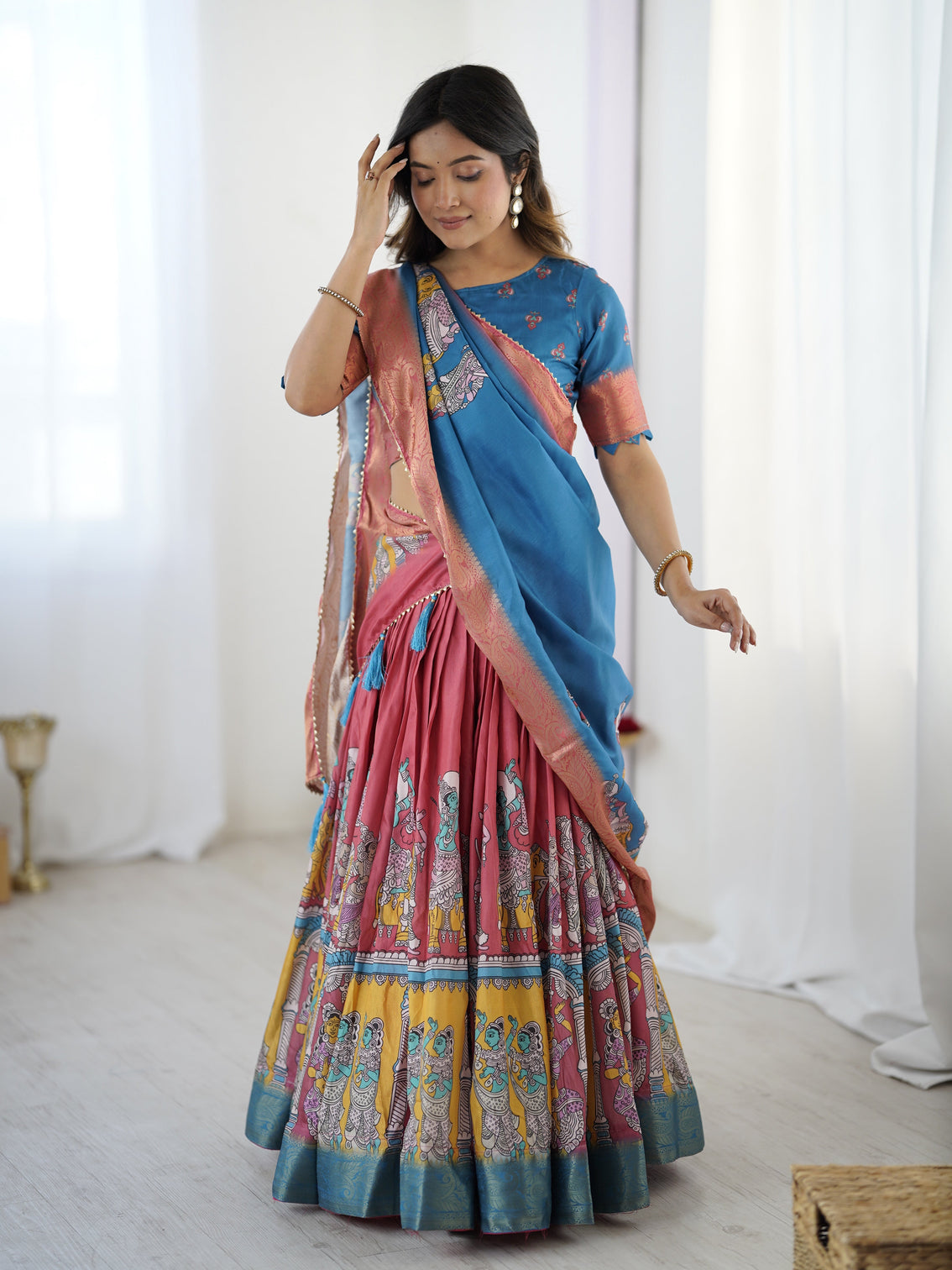 Elegant kalamkari lehenga in blue and terracotta pink with flared skirt and dupatta