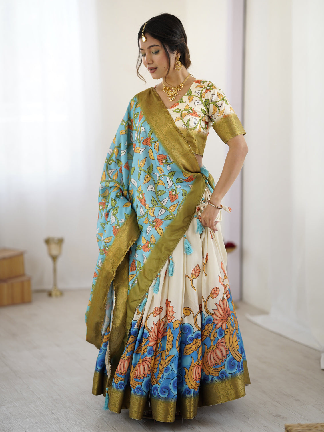 Off white blue kalamkari silk lehenga with olive zari border tassel dupatta festive wedding wear