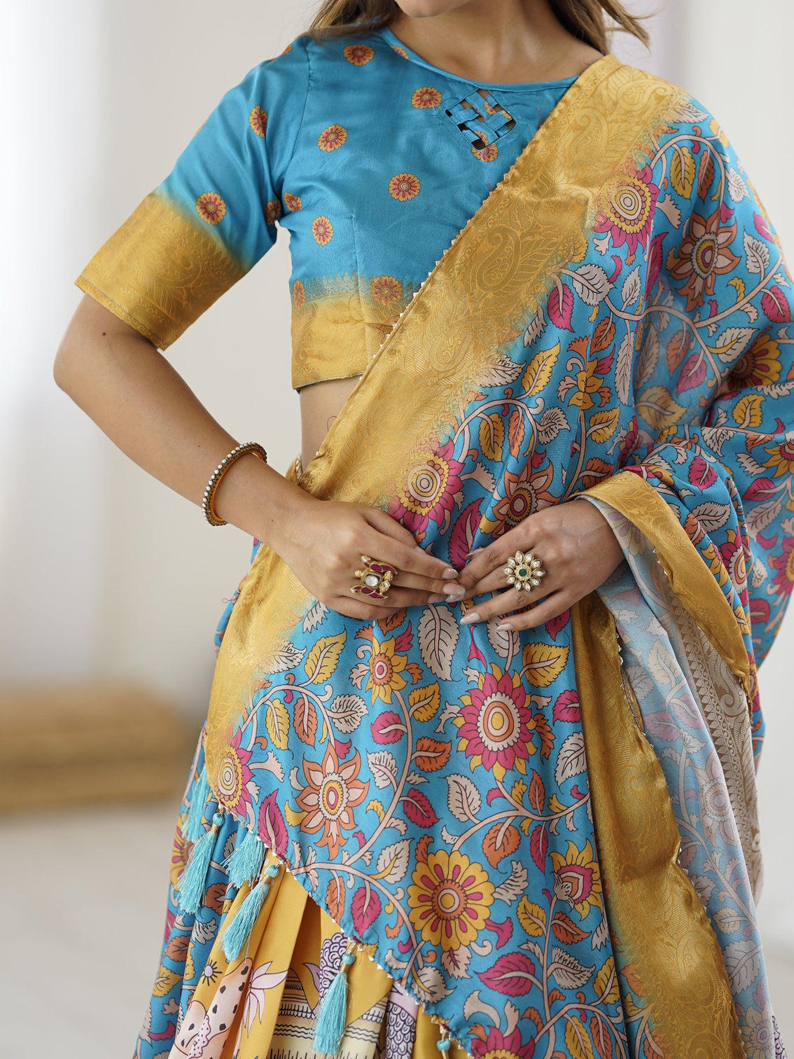 Elegant kalamkari lehenga in blue and peach with floral dupatta and flared skirt