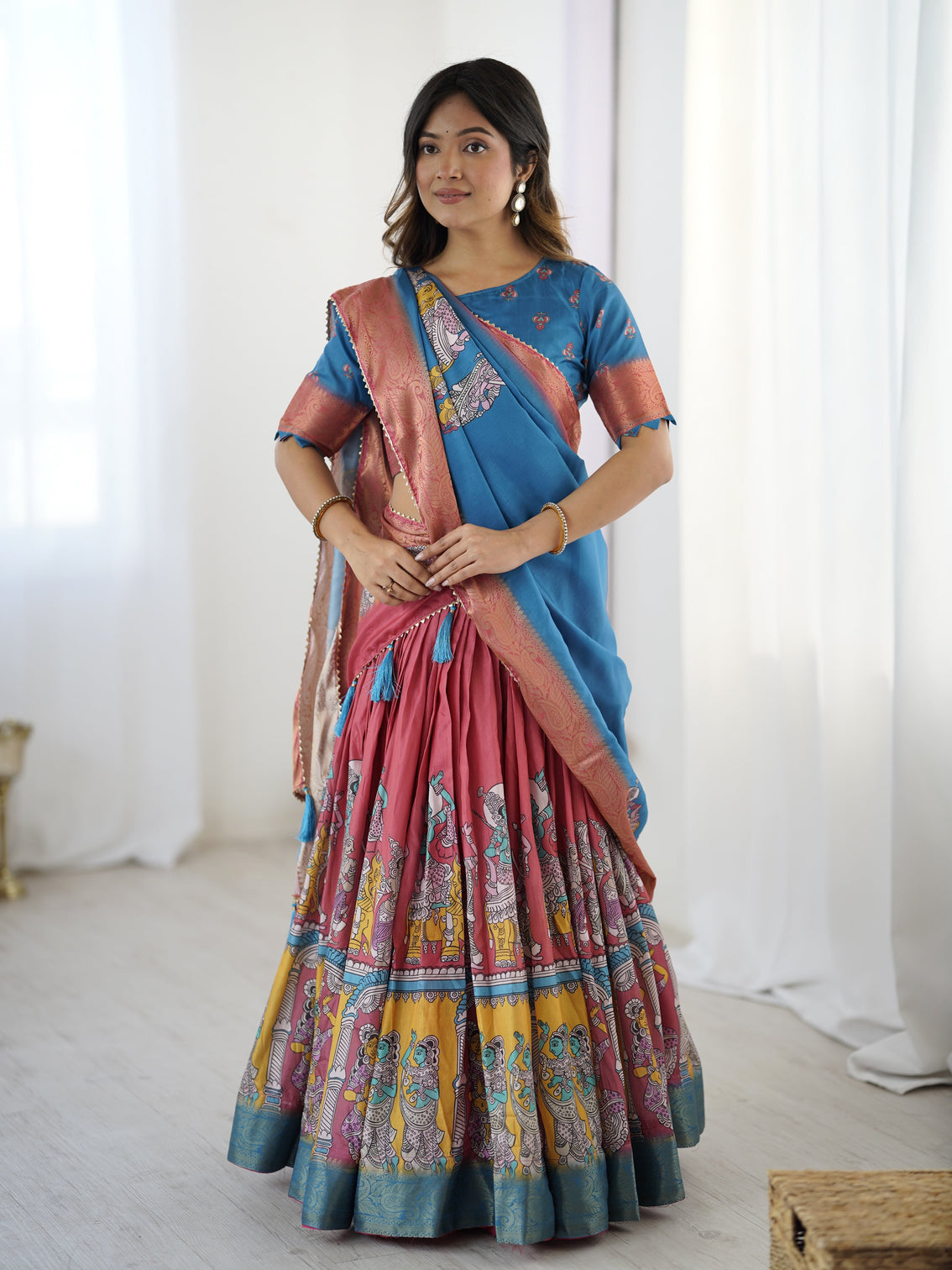 Elegant kalamkari lehenga in blue and terracotta pink with flared skirt and dupatta