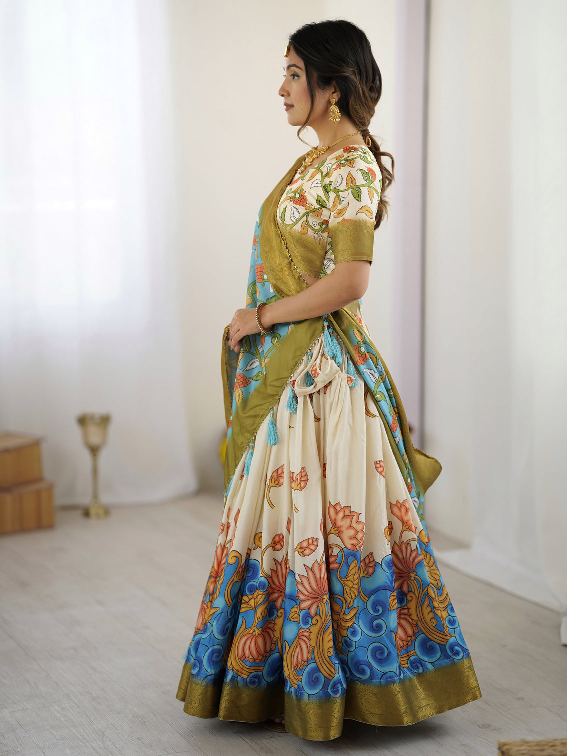 Off white blue kalamkari silk lehenga with olive zari border tassel dupatta festive wedding wear