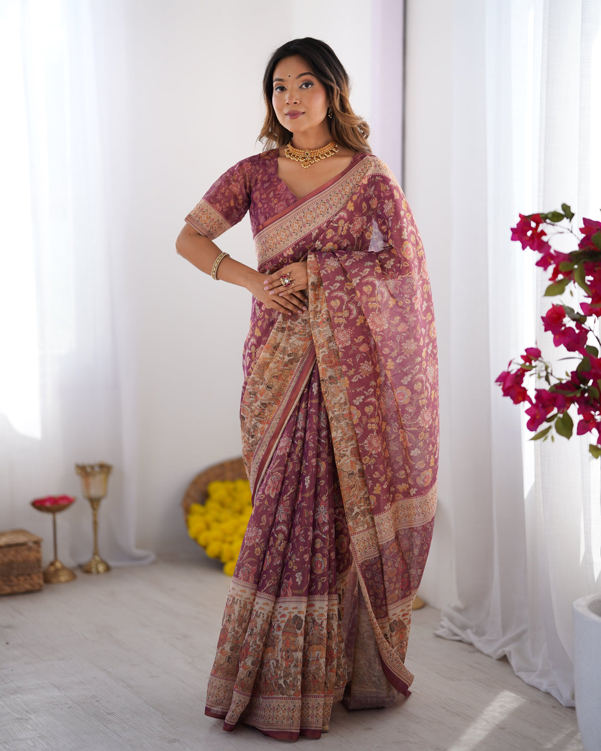 Plum handloom cotton saree with floral print mythical border tassels