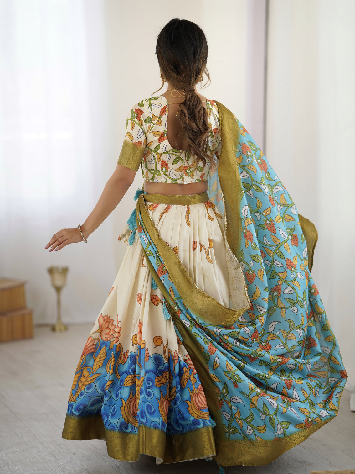 Off white blue kalamkari silk lehenga with olive zari border tassel dupatta festive wedding wear