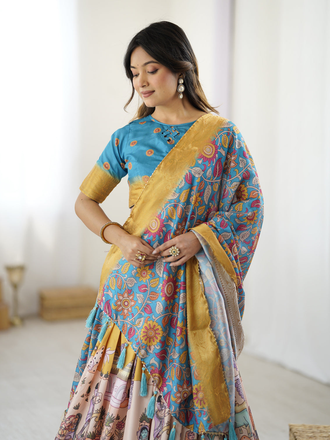 Elegant kalamkari lehenga in blue and peach with floral dupatta and flared skirt